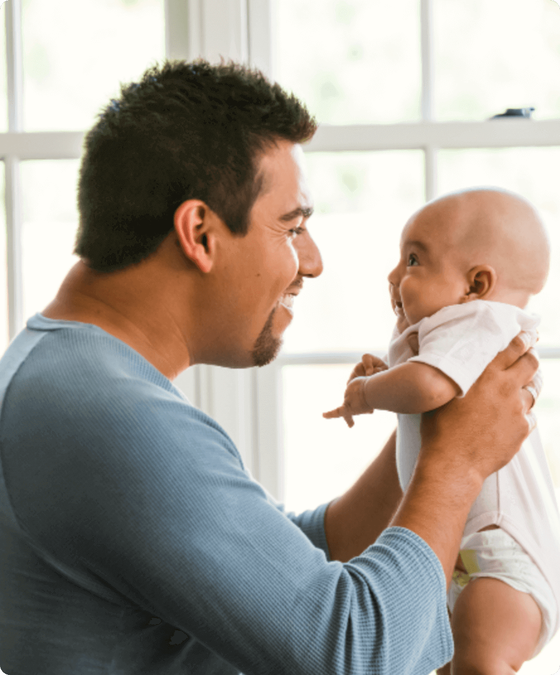 A father holding his baby in front of him